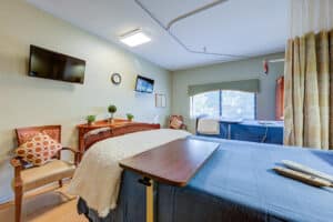 Double occupancy room facing flat screen tv and large window